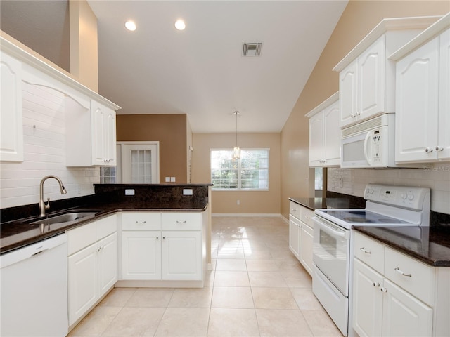 kitchen with white cabinetry, white appliances, light tile patterned floors, lofted ceiling, and sink