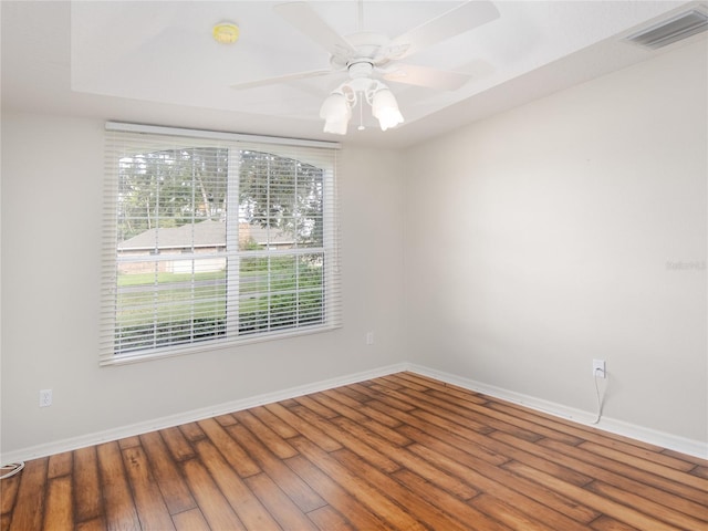 unfurnished room with ceiling fan and hardwood / wood-style flooring