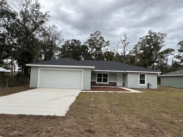 ranch-style house with a front lawn and a garage