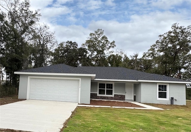 ranch-style house with a garage and a front lawn