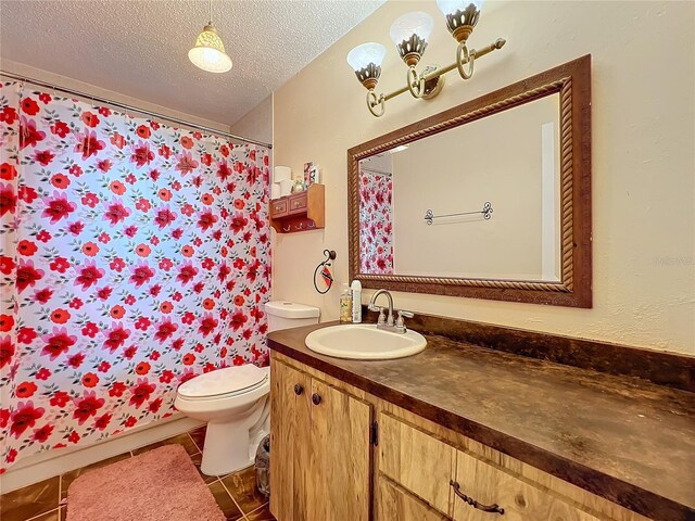 bathroom with vanity, a textured ceiling, tile patterned flooring, toilet, and a shower with curtain