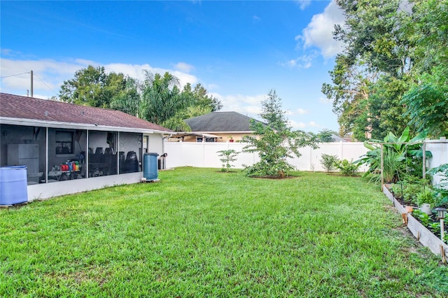 view of yard with a sunroom