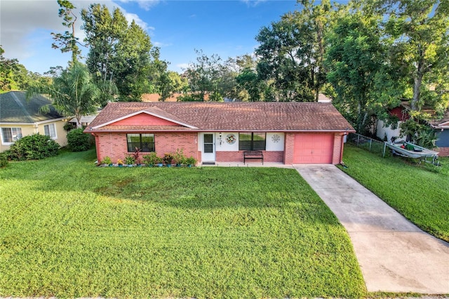 ranch-style home with a front lawn and a garage