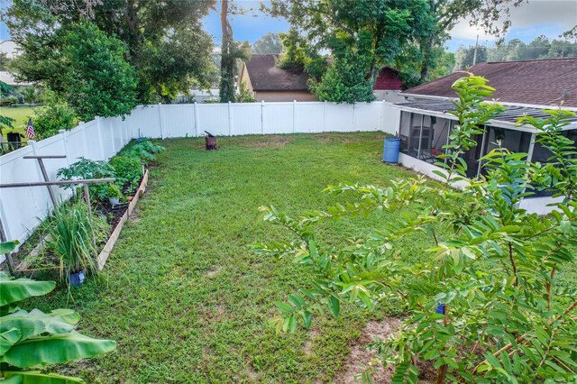 view of yard featuring a sunroom