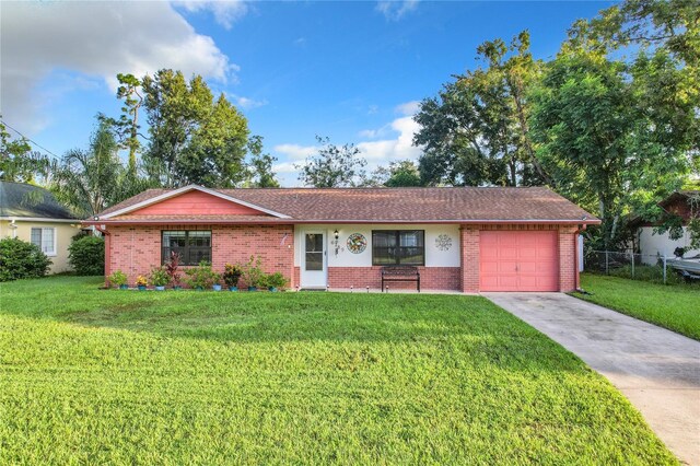 single story home with a front lawn and a garage