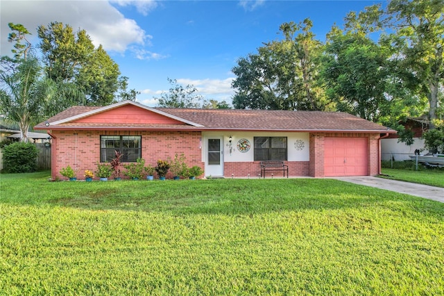 single story home featuring a front lawn and a garage