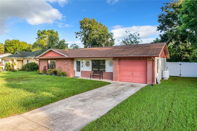 single story home with driveway, a gate, a front lawn, brick siding, and a garage