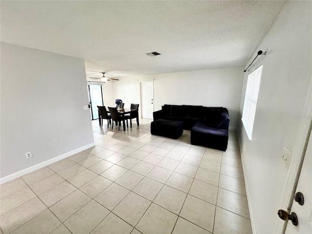 6789 SE 54th Ln, Ocala, FL 34472 - living area with light tile patterned floors, healthy amount of natural light, and ceiling fan