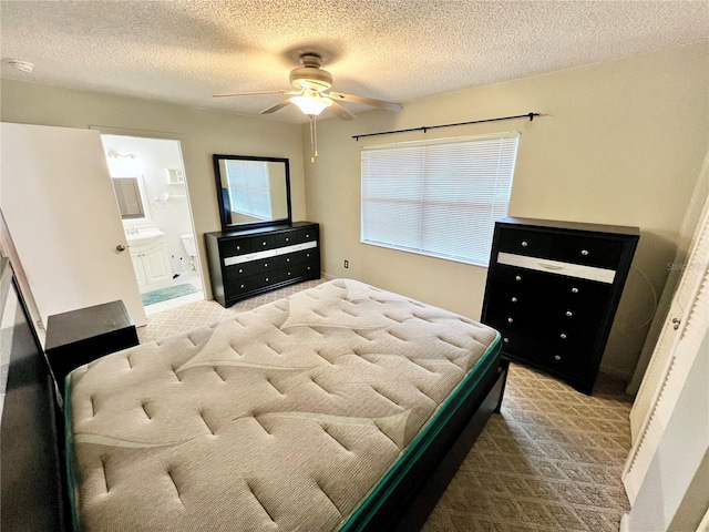 6789 SE 54th Ln, Ocala, FL 34472 - carpeted bedroom with a textured ceiling, ensuite bath, and a ceiling fan