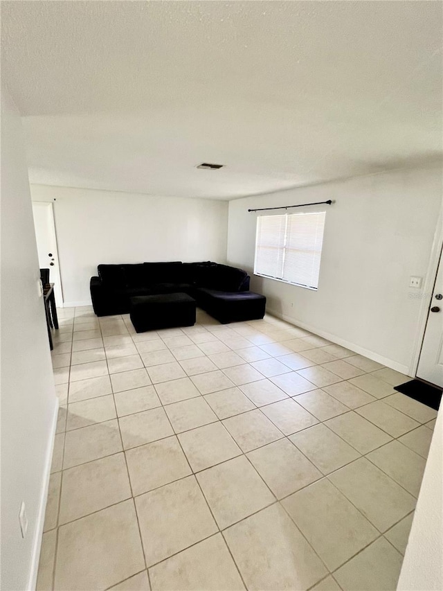 6789 SE 54th Ln, Ocala, FL 34472 - living room featuring light tile patterned floors and a textured ceiling