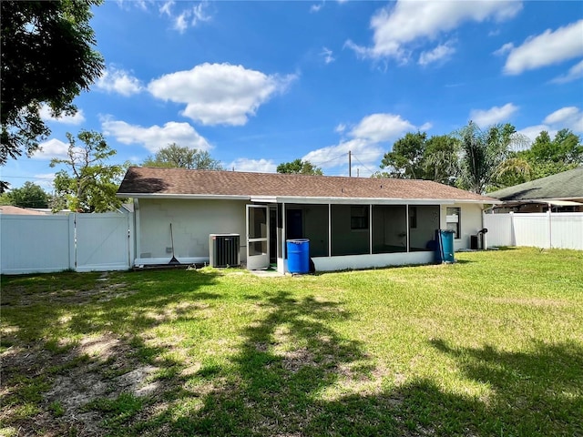 6789 SE 54th Ln, Ocala, FL 34472 - back of property with a gate, a sunroom, and stucco siding