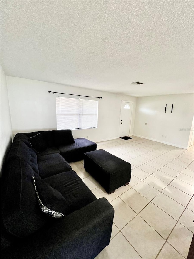 6789 SE 54th Ln, Ocala, FL 34472 - living room featuring light tile patterned floors and a textured ceiling