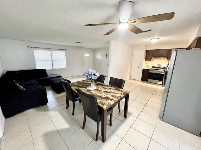 6789 SE 54th Ln, Ocala, FL 34472 - dining space featuring a textured ceiling, light tile patterned floors, and ceiling fan