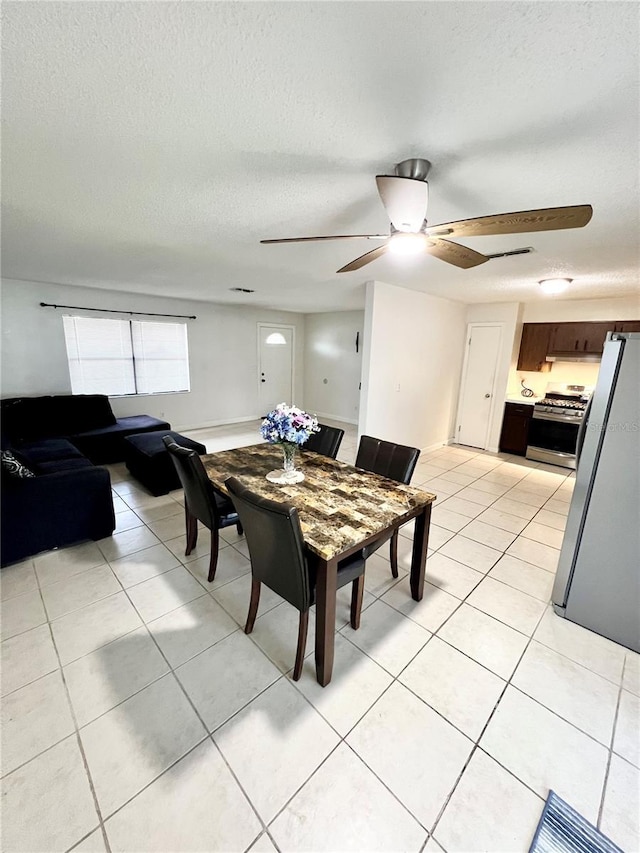 6789 SE 54th Ln, Ocala, FL 34472 - dining space featuring a ceiling fan, light tile patterned floors, and a textured ceiling