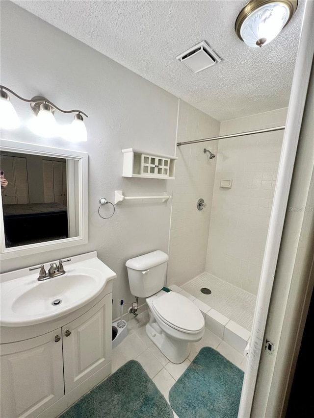 6789 SE 54th Ln, Ocala, FL 34472 - full bath featuring a shower stall, vanity, tile patterned floors, and a textured ceiling