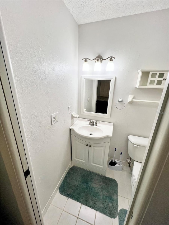6789 SE 54th Ln, Ocala, FL 34472 - half bathroom featuring vanity, tile patterned flooring, and a textured ceiling