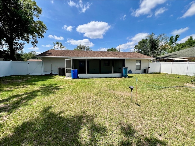 6789 SE 54th Ln, Ocala, FL 34472 - rear view of property with a gate, a sunroom, a fenced backyard, and stucco siding