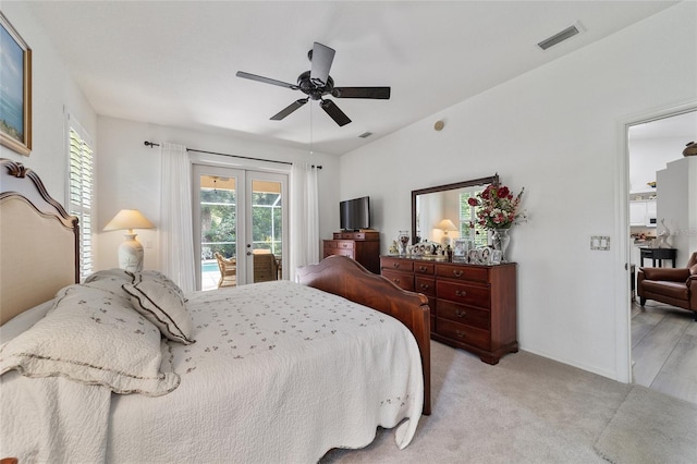 bedroom featuring ceiling fan, light wood-type flooring, french doors, and access to outside