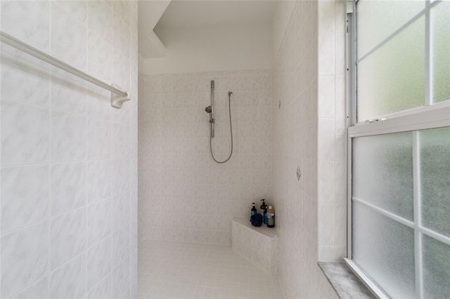 bathroom with tiled shower