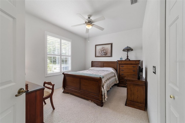 bedroom featuring ceiling fan and light colored carpet