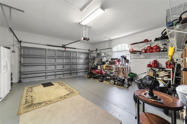 garage featuring a garage door opener and white refrigerator with ice dispenser