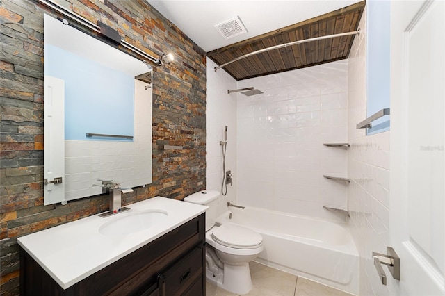 full bathroom with vanity, tile patterned floors, tiled shower / bath combo, and toilet