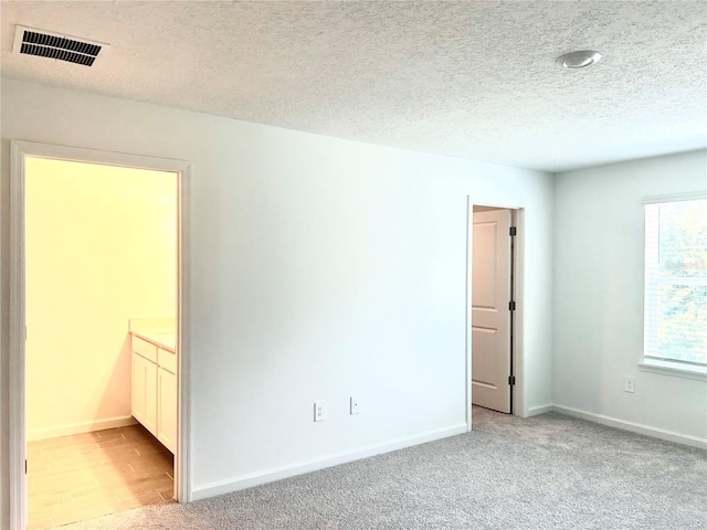 interior space featuring a textured ceiling