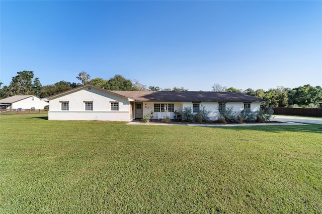 ranch-style house with a front yard