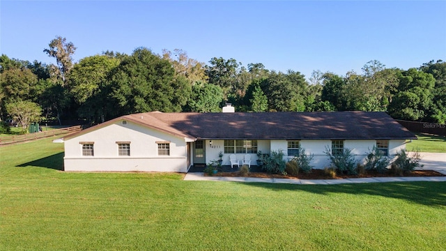 ranch-style home with a front yard