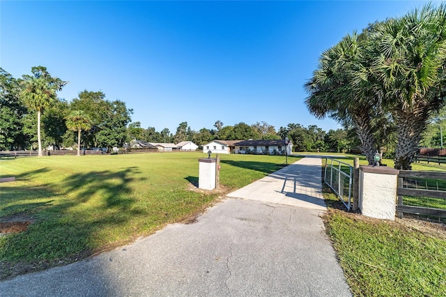 view of property's community featuring a lawn