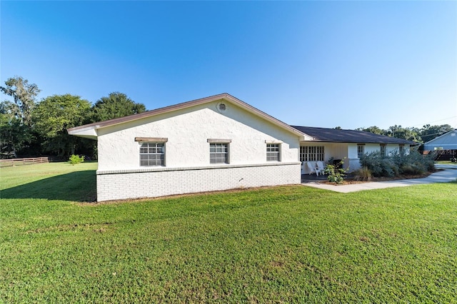 view of property exterior featuring a yard