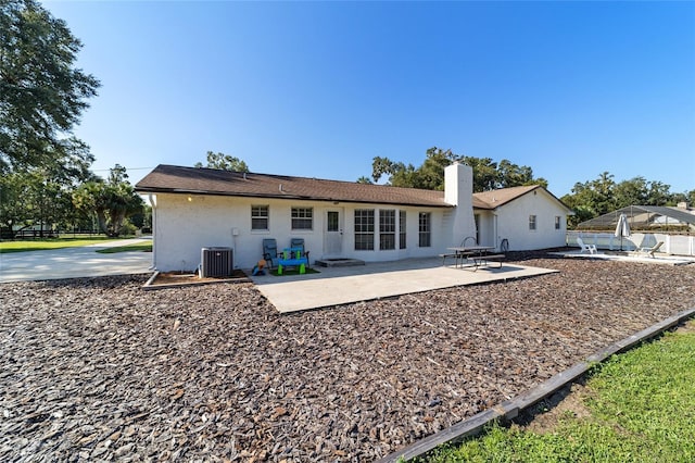 back of house featuring a patio and central AC unit