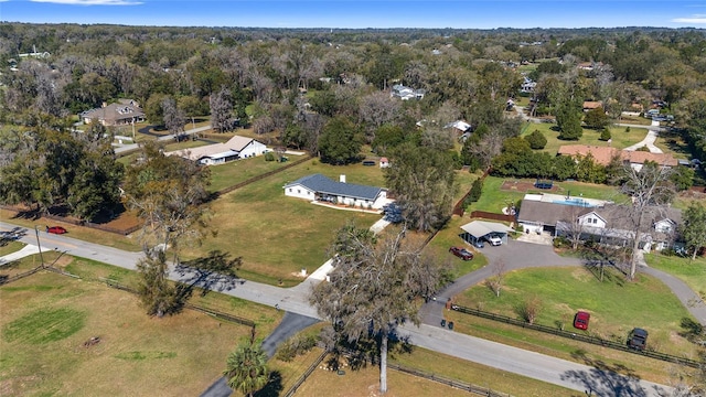 aerial view with a residential view and a view of trees