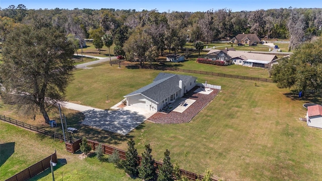 drone / aerial view featuring a view of trees