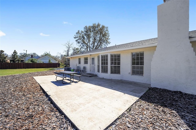 view of patio / terrace featuring fence