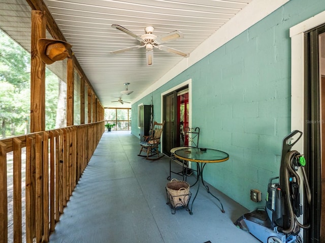 view of patio featuring ceiling fan