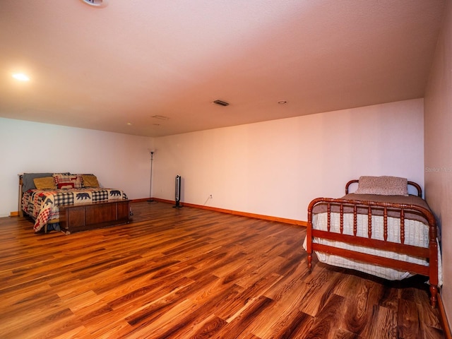 bedroom featuring wood-type flooring