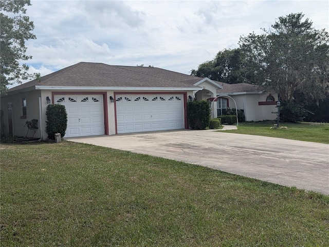 ranch-style home with a garage and a front yard