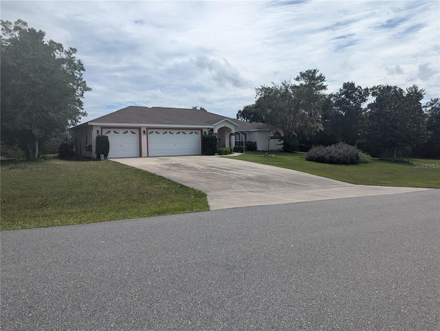 ranch-style house featuring a garage and a front lawn