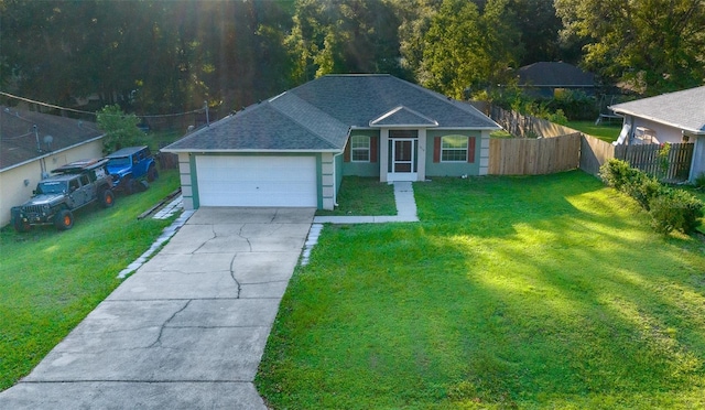 view of front of home with a garage and a front lawn