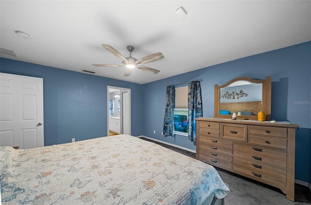 carpeted bedroom featuring ceiling fan and ensuite bathroom