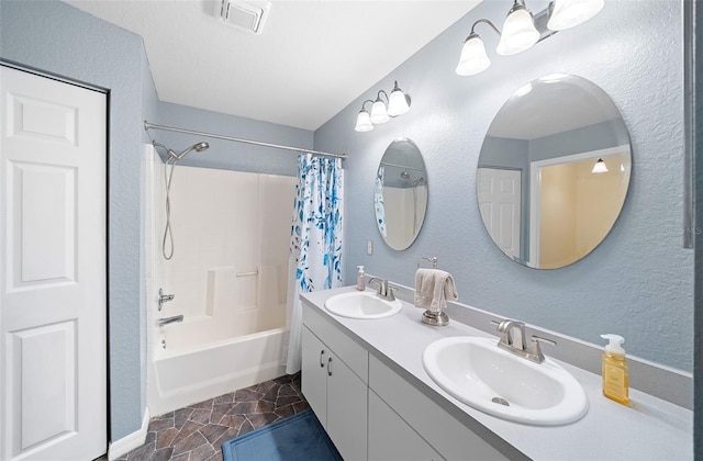 bathroom featuring vanity and shower / tub combo with curtain