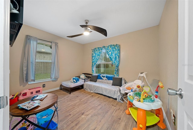 bedroom featuring ceiling fan and wood-type flooring