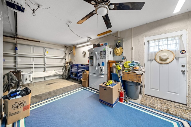 garage with ceiling fan and stainless steel fridge