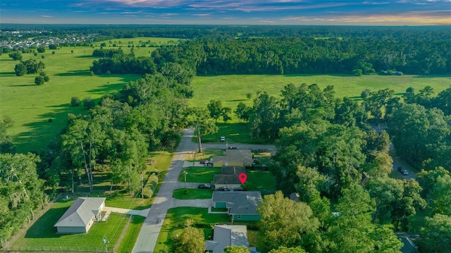 aerial view at dusk featuring a rural view