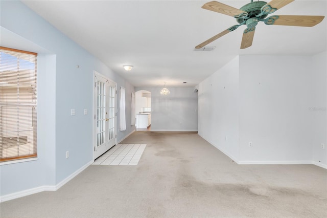 carpeted empty room with ceiling fan