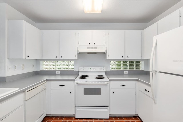 kitchen featuring white appliances and white cabinets