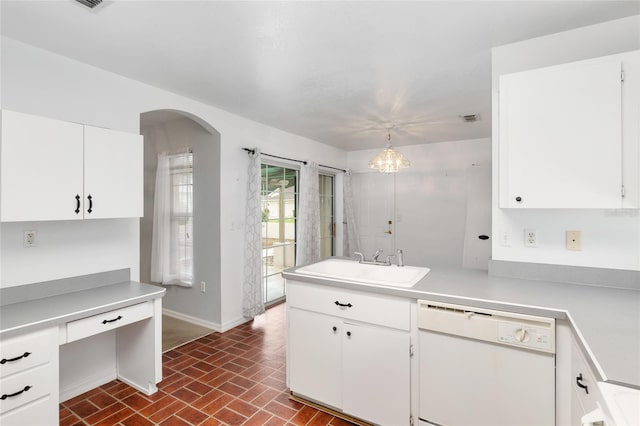 kitchen featuring pendant lighting, white cabinetry, and dishwasher