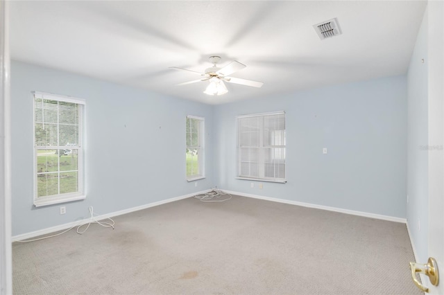 carpeted empty room with ceiling fan