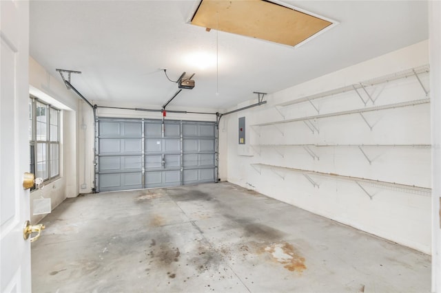 garage featuring a garage door opener and electric panel